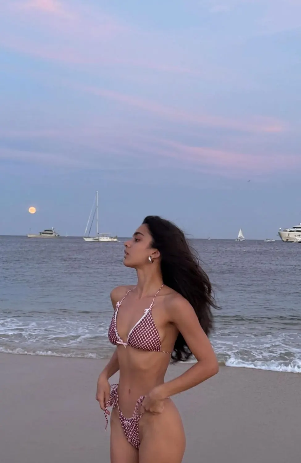 Pink bikini at sunset on the beach